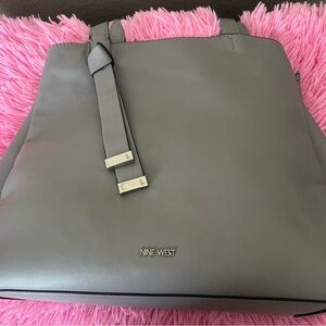 Nine West handbag/shoulder bag. Gray/sliver. Zippered compartment in center.